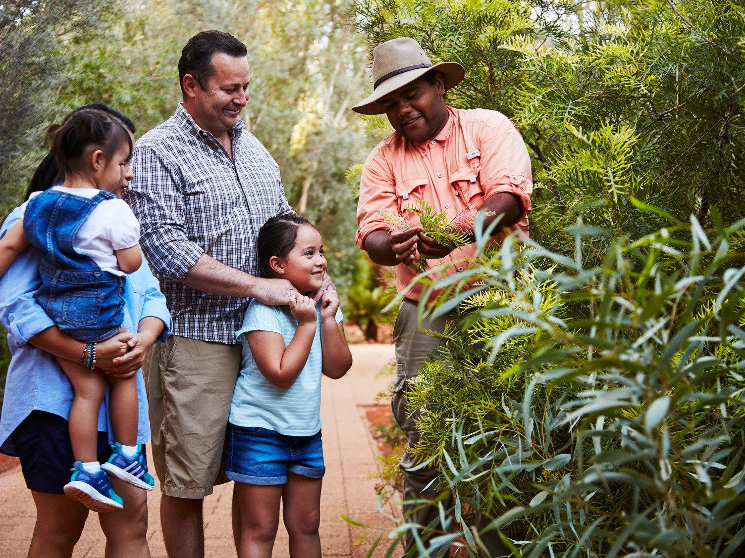 Family enjoying a bush food experience at ayers rock resort