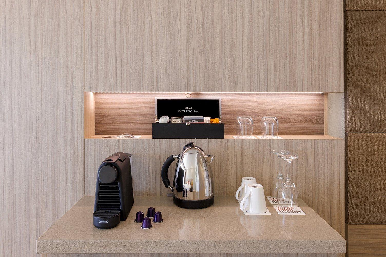 Kitchenette with kettle, pod coffee machine, coffea and tea bags, cups and mugs