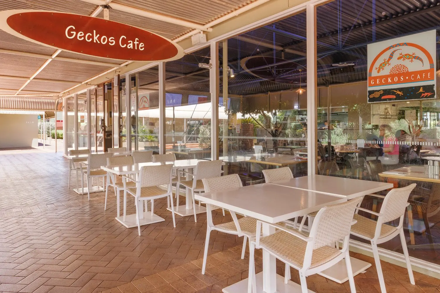 White Table and chairs outside of Geckos Cafe located in Towns Square at Ayers Rock Resort