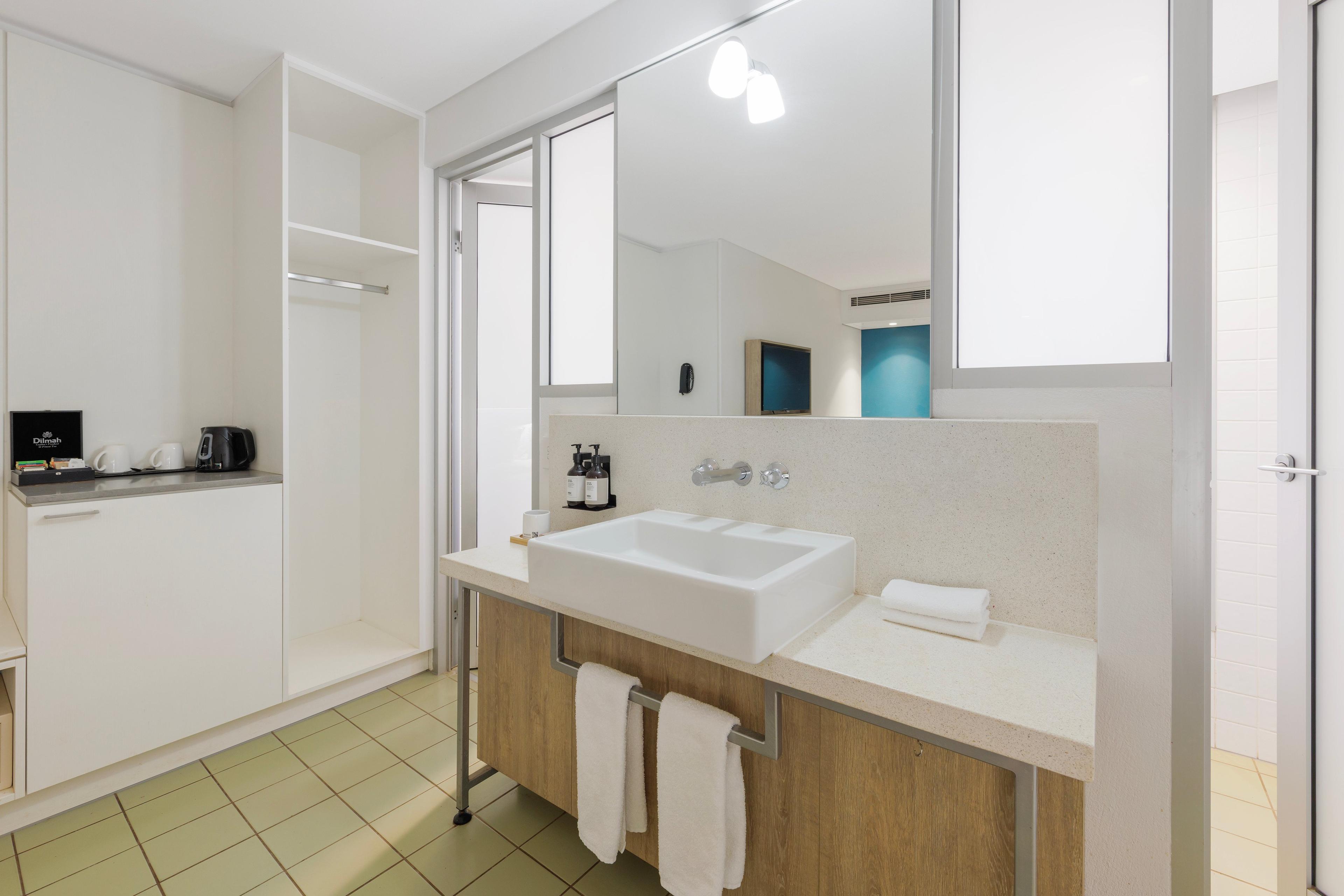 Sink sitting on top of cabinet with Wiru products