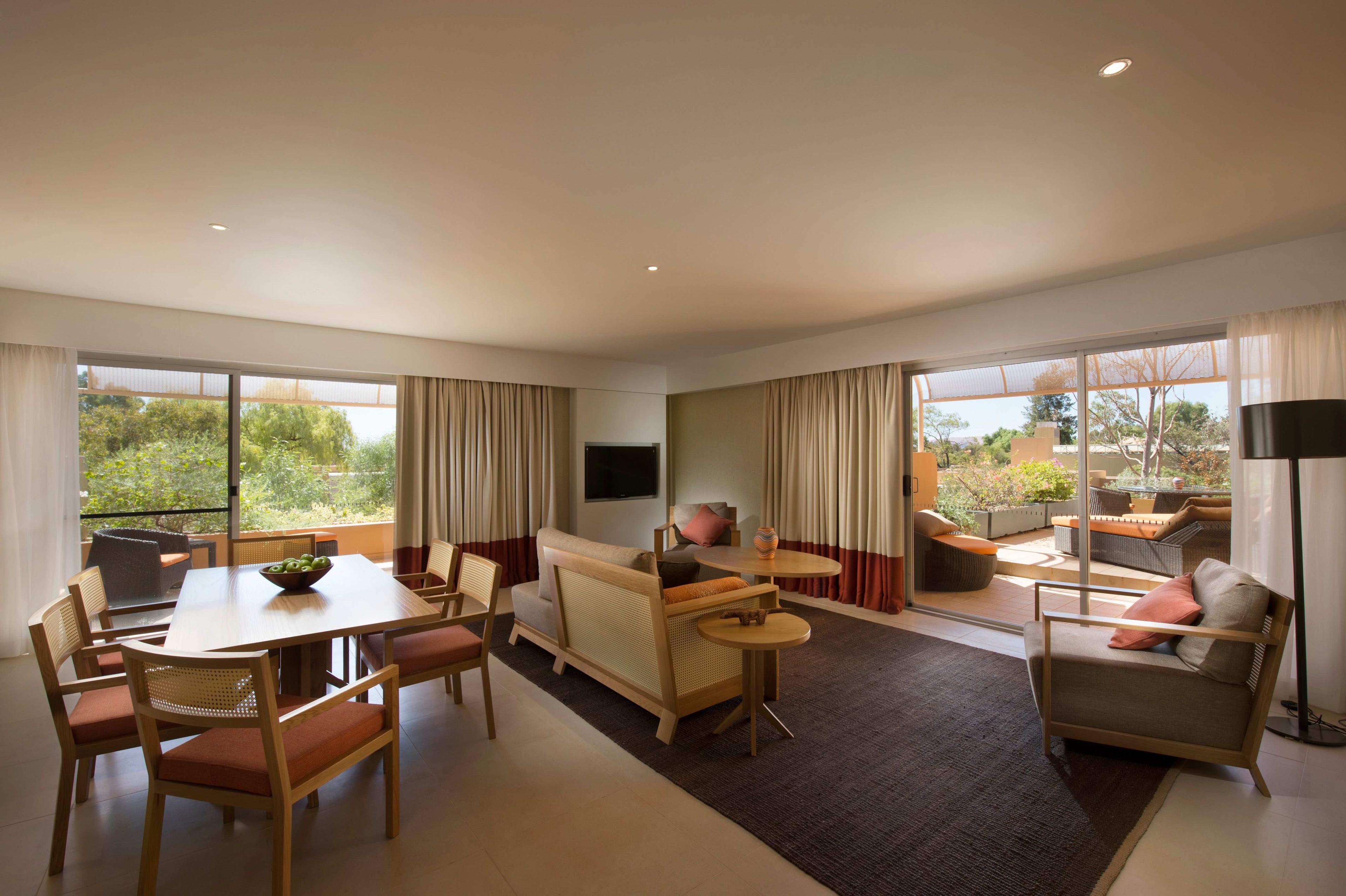 Large living area with dining table and couches | Uluru Australia | Uluru Rockies | Mossmangor Indigenous Tourism