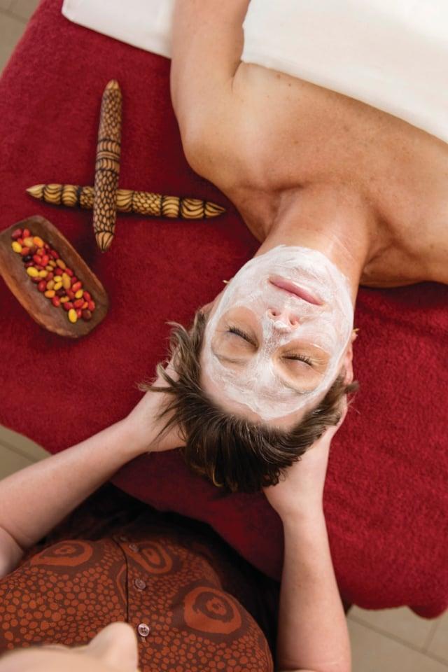 Woman getting a facial at the spa; Woman having her facial done at Longitude 131° stay Australia