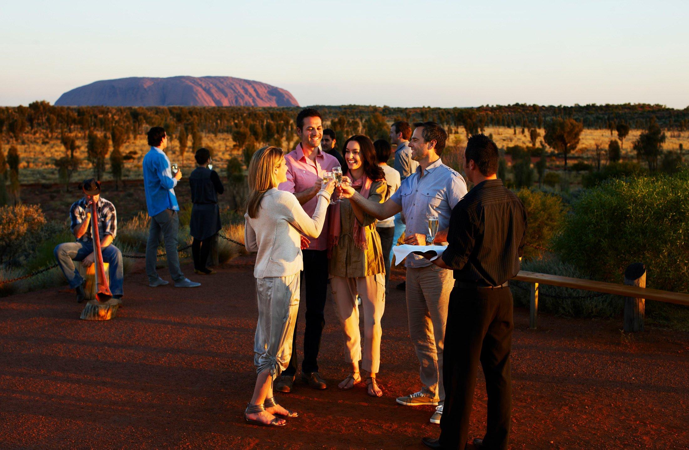  | Uluru Australia | Uluru Rockies | Mossmangor Indigenous TourismA group socializing with champagne outside