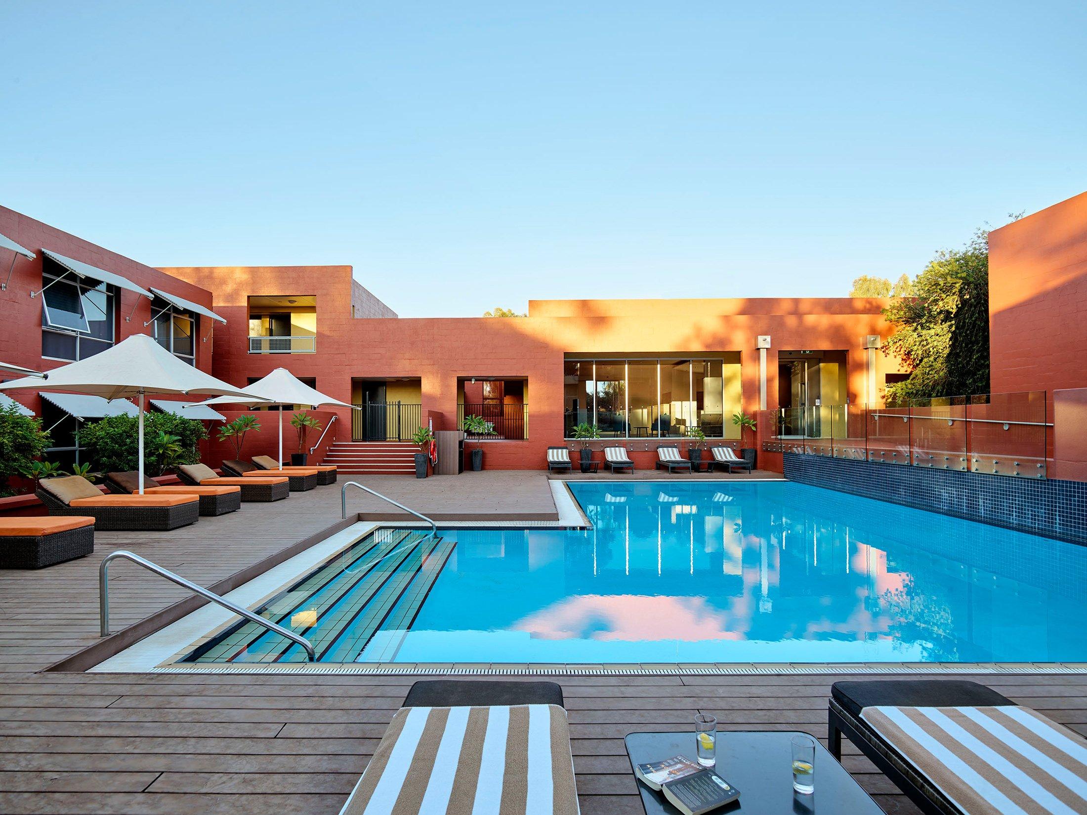 An outdoor pool at The Lost Camel | Uluru Australia | Uluru Rockies | Mossmangor Indigenous Tourism