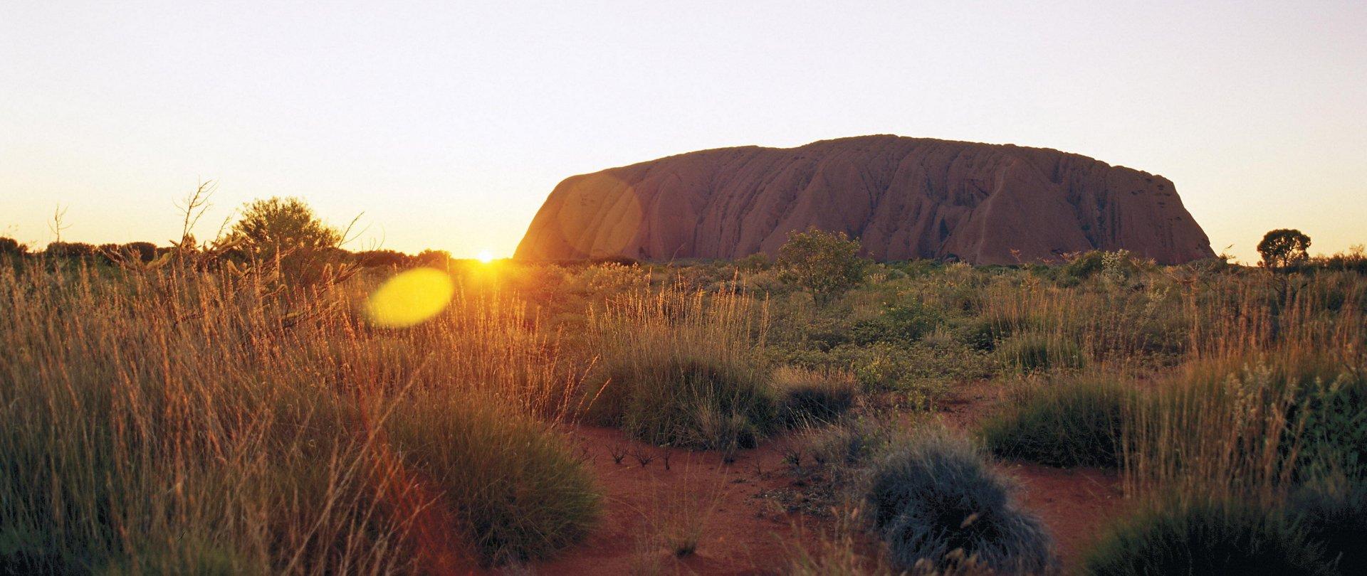 sunrise behind Uluru