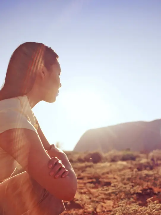 a woman outside in the sun