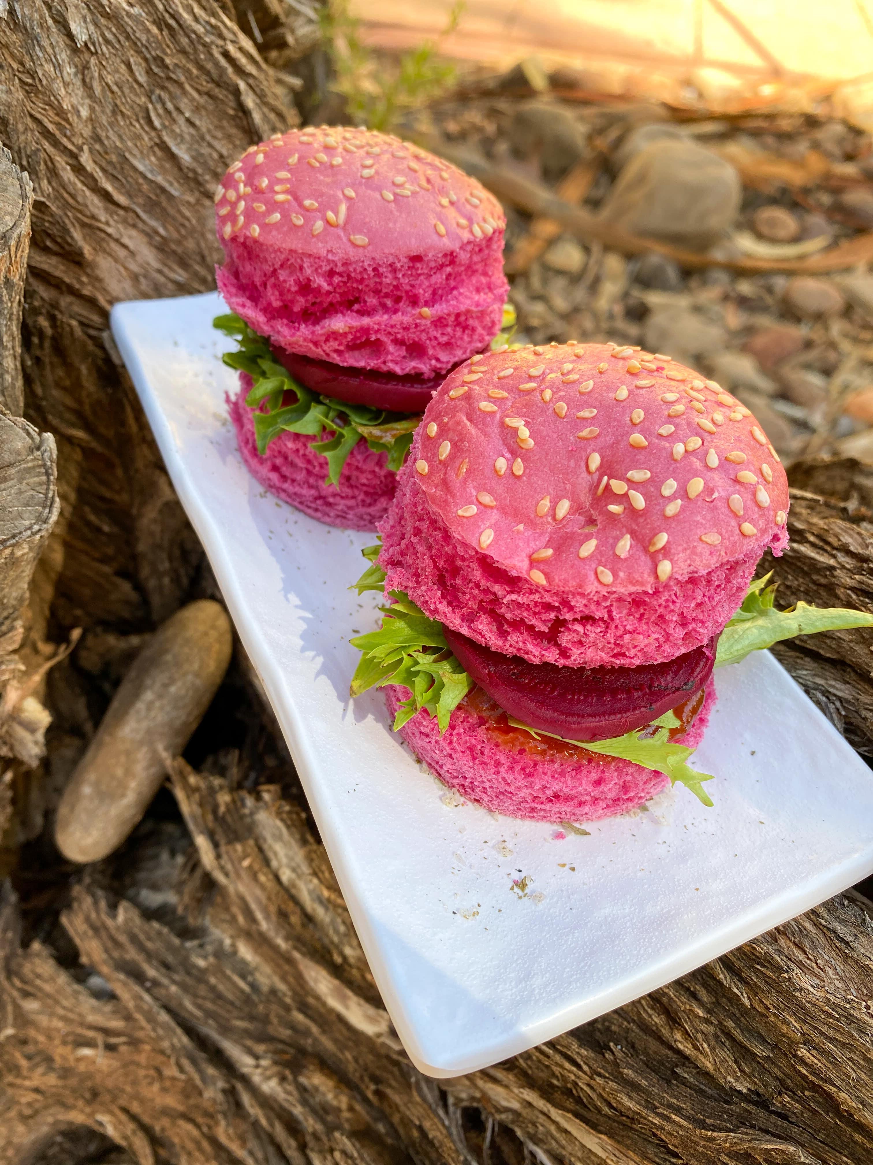 Braised beetroot on a pink bun