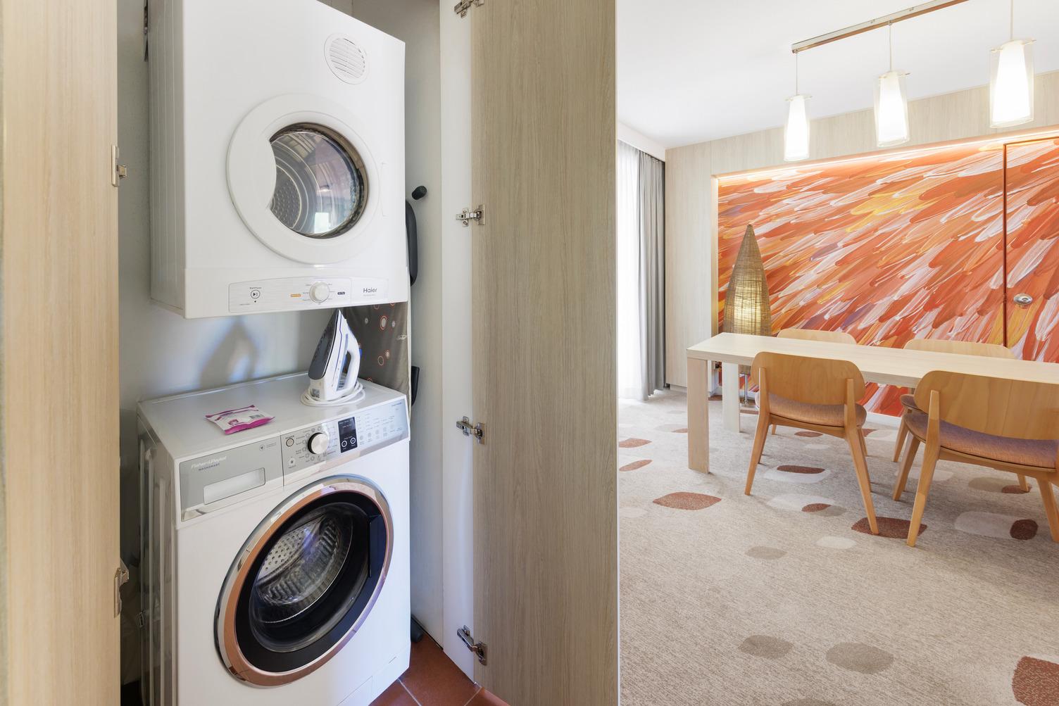 Washing Machine and dryer looking out onto the dining area