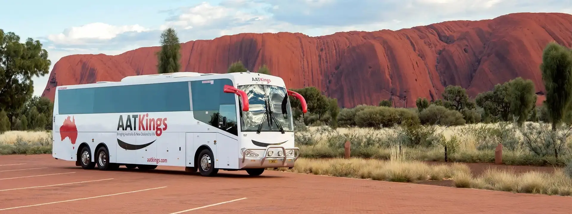 AAT Kings Coach in front of Uluru