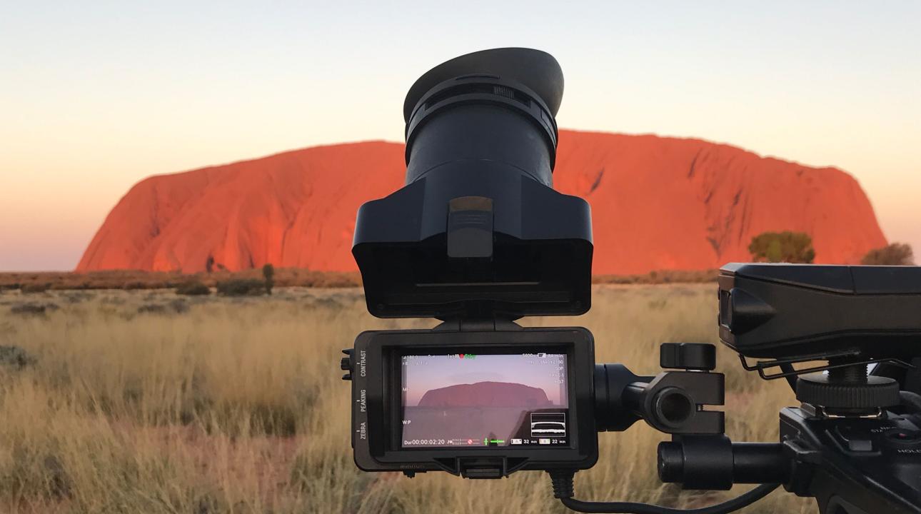 camera in front of Uluru